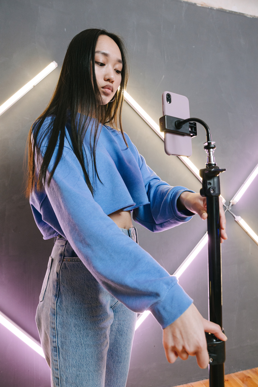 Woman in Blue Long Sleeve Shirt and Blue Denim Jeans